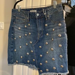 Good American jean skirt with silver embellishments.